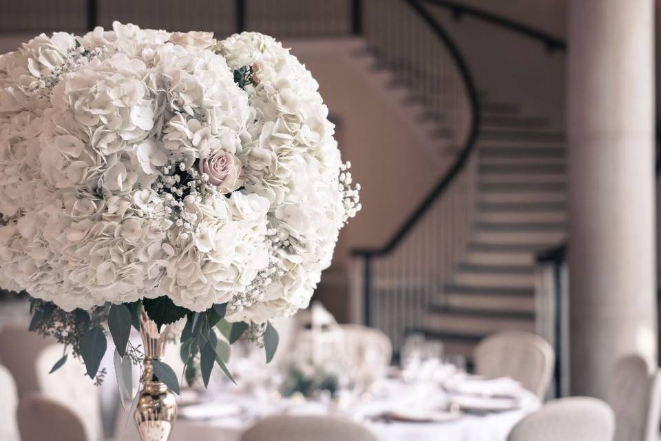 Table setting with flowers as centerpiece