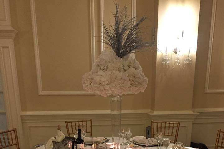 Table setting with tall floral centerpiece