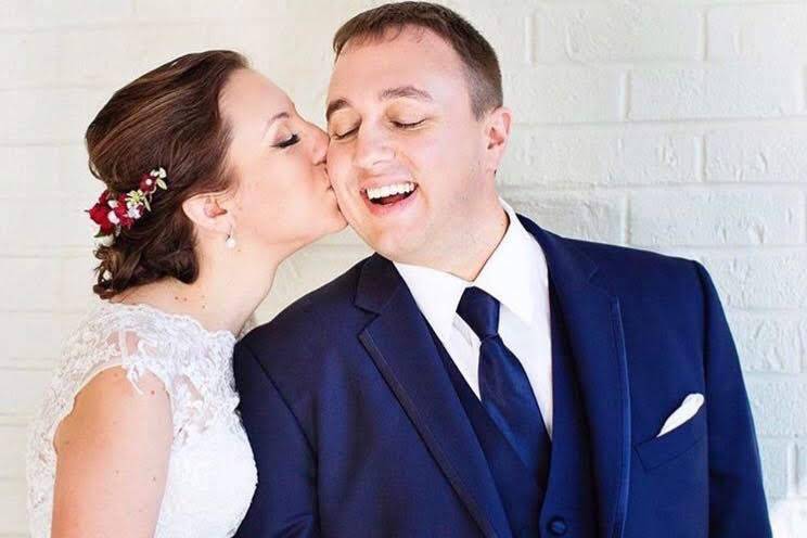 Kissing her groom