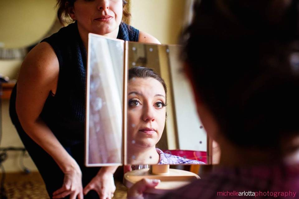 Checking her makeup