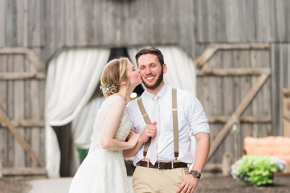 Bride kissing groom