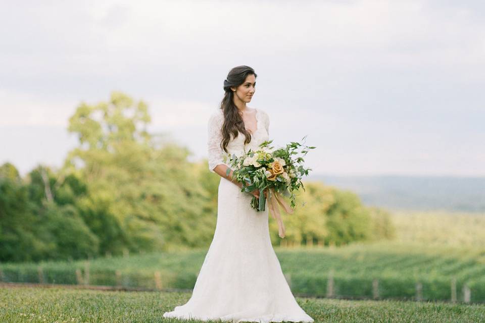 Wedding editorial photographed by Kacie Lych and styled by Elisa Bricker at a charming vineyard in Virginia is the epitome of laid-back sophistication. With a muted color palette and little splashes of gold, this wedding inspiration shoot is absolutely exquisite! From Kacie Lynch Photography