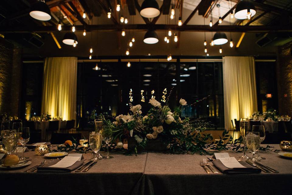 Beam Chandelier at The Roundhouse in Beacon, NY. Photo by The Ramsdens, Florals by Dark & Diamond Floral Design.