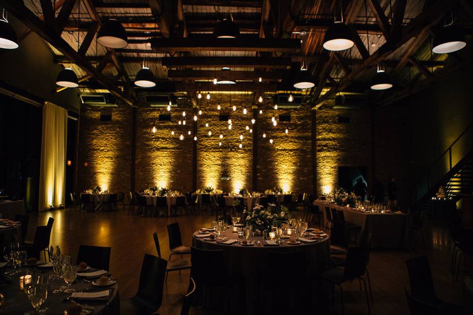 Up-Lights (with our Beam Chandelier) at The Roundhouse in Beacon, NY. Photo by The Ramsdens, Florals by Dark & Diamond Floral Design.