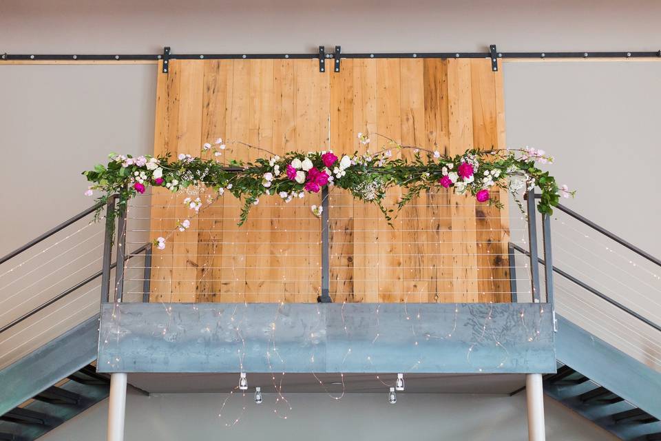 Fairly Lights on the stairs at The Roundhouse in Beacon, NY. Photo by JacPfef Photography. Florals by Dark & Diamond Floral Design.