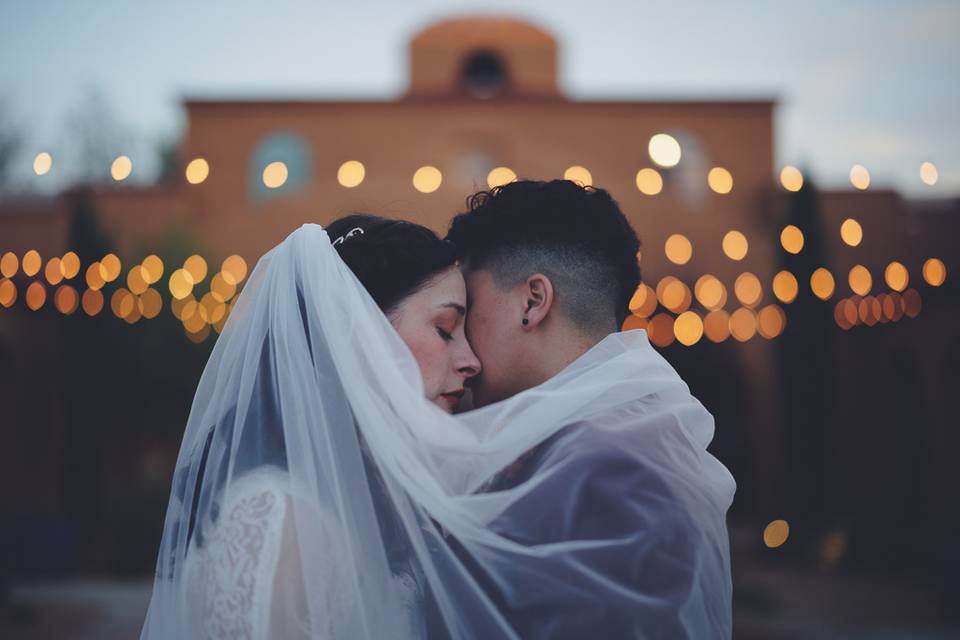 Brides wrapped in a veil