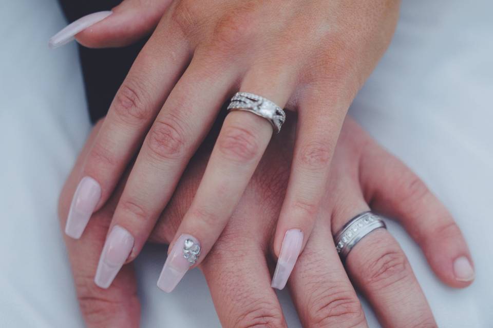 Wedding rings hand in hand
