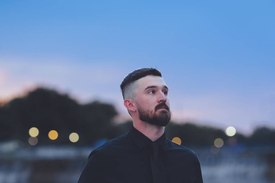 Pose in front of a lake groom