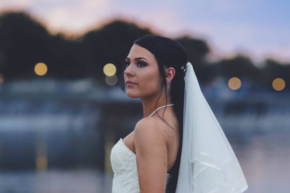 Pose in front of a lake bride