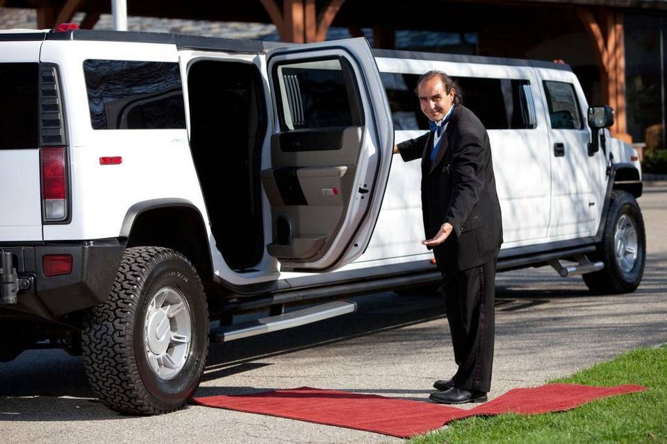 Chauffeur opening the limo door