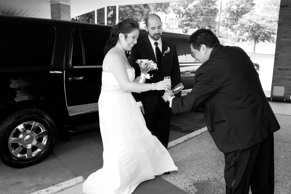 Newlyweds by the limo