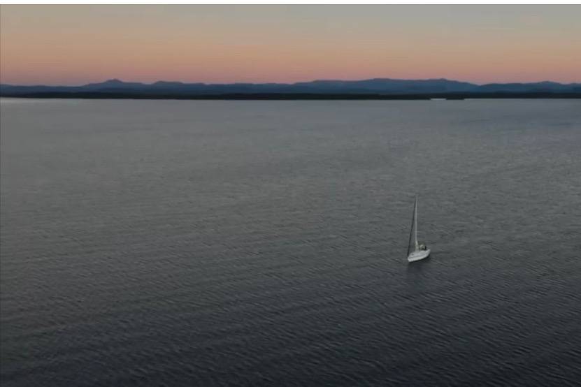 Sailboat At Sunset