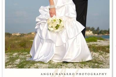 A sensual kiss at the beach after their wedding ceremony at Lido Key Beach in Sarasota, Florida.