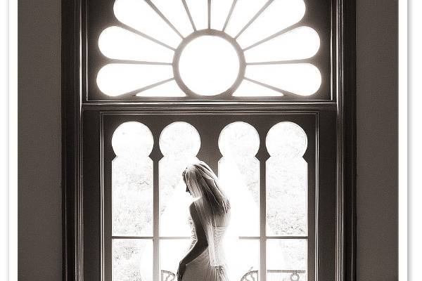 Dramatic black and white portrait of a bride in her full-length wedding gown in Tampa.
