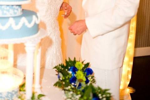 The couple having a taste of their cake