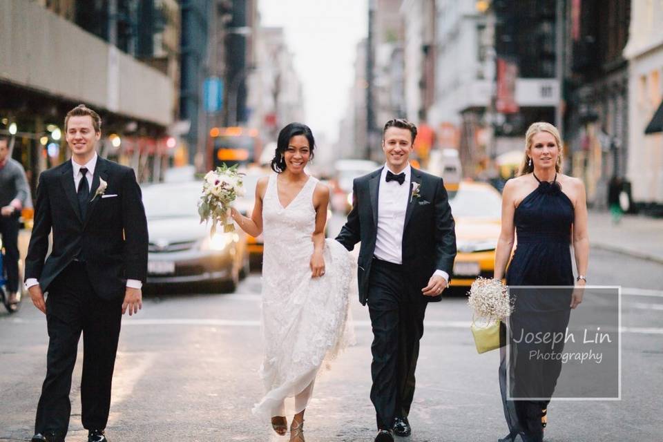 The couple with the bridesmaid and groomsman