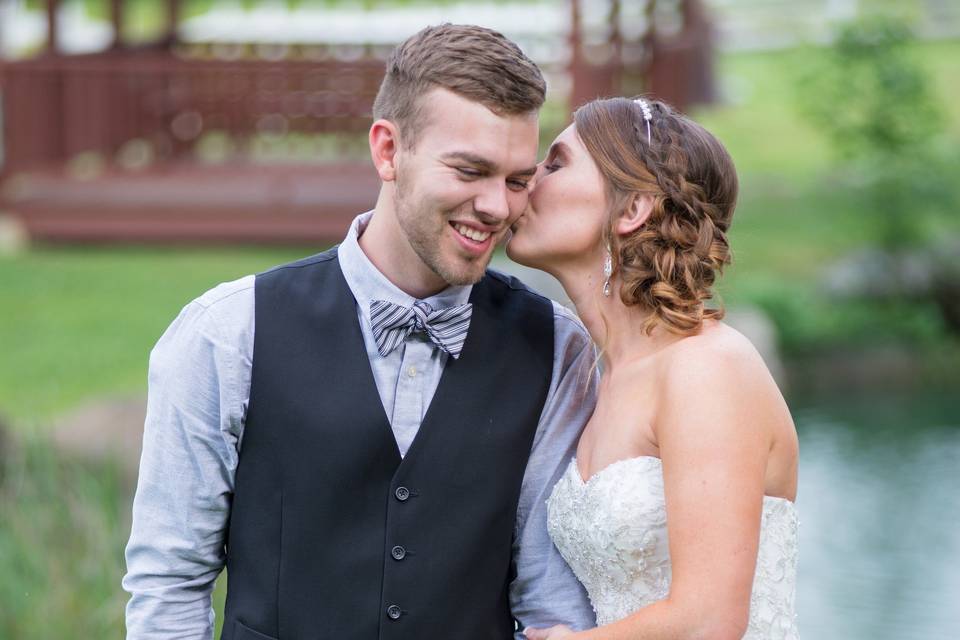 Bride kissing her groom