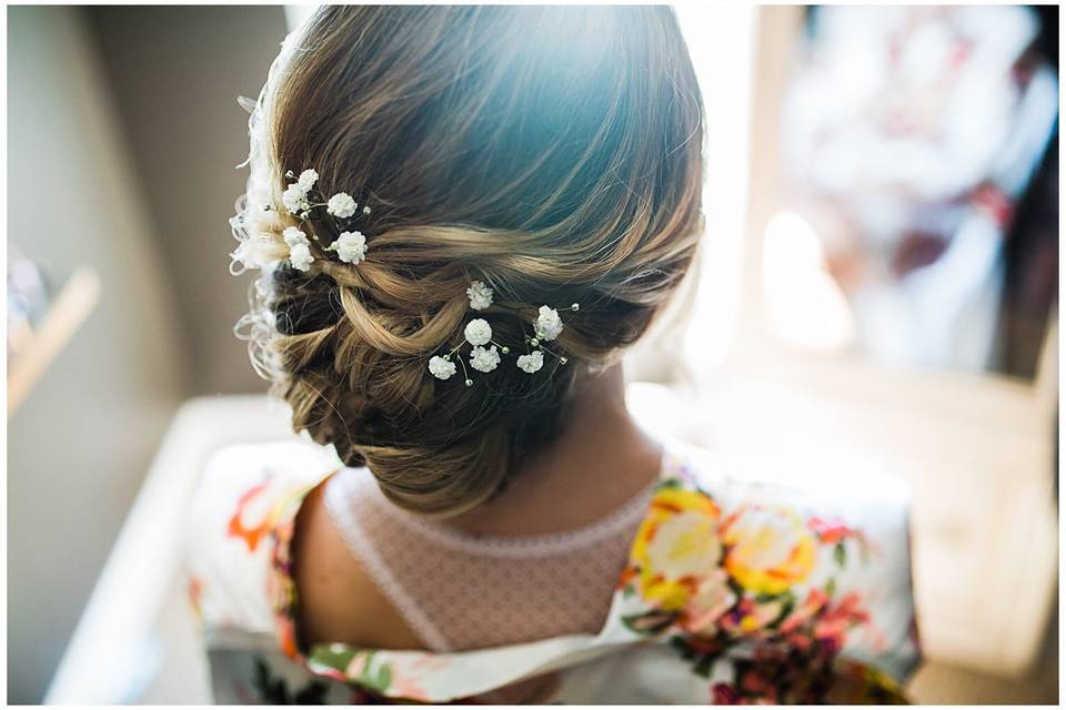 Bridal updo with floral notes