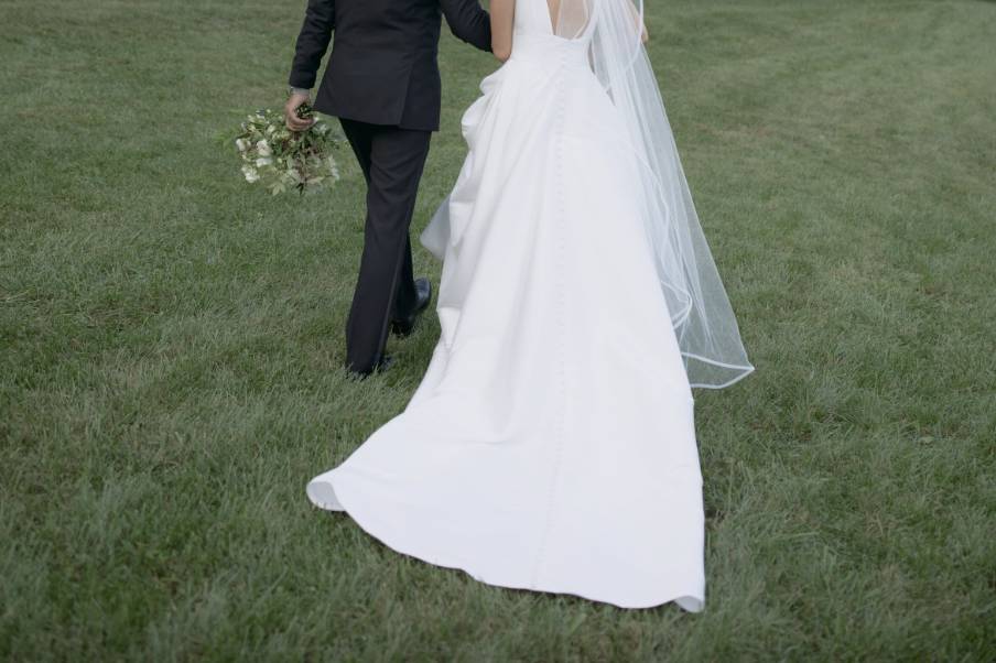 Couple running in field