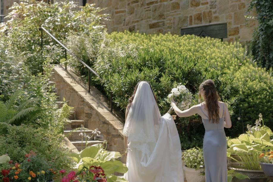 Maid of honor helping bride