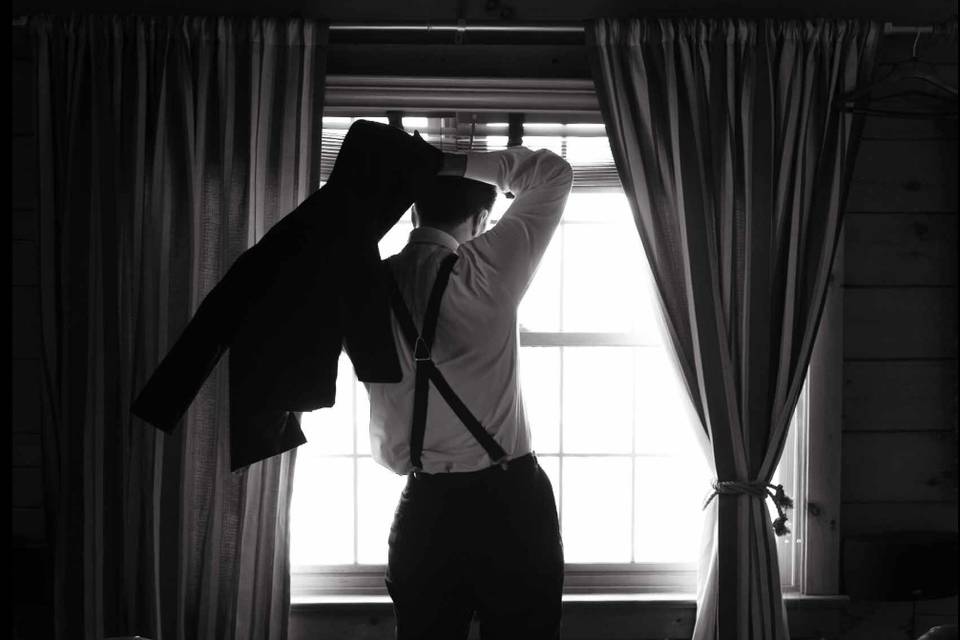 Groom getting dressed