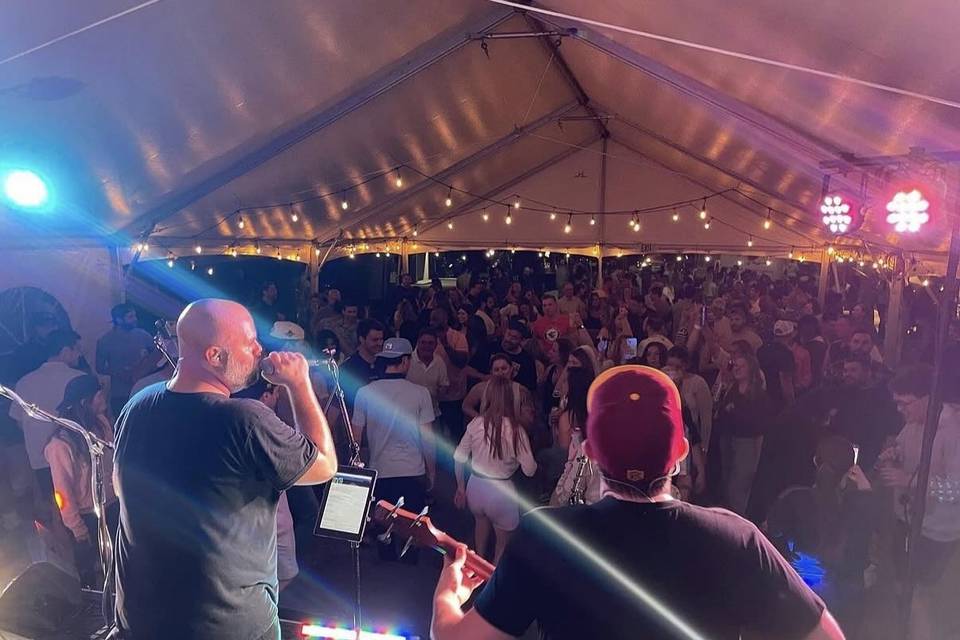 Fantasm brings live pop and rock to a tented party.