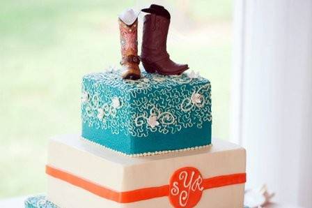 Square wedding cake with boots on top