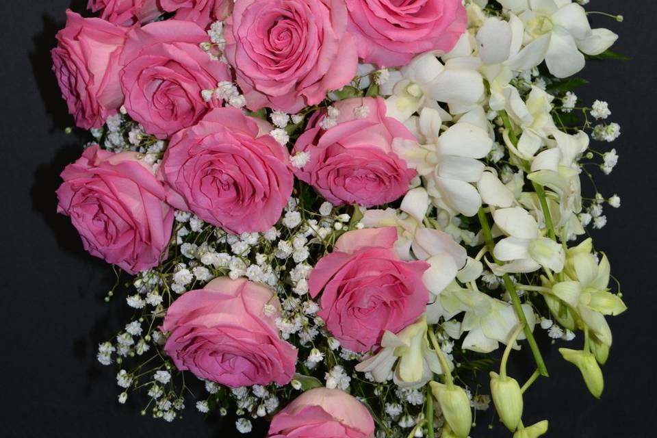 Pink roses & white orchids.