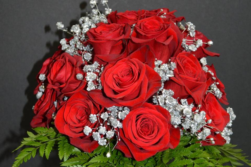 Red wrapped rose bouquet.