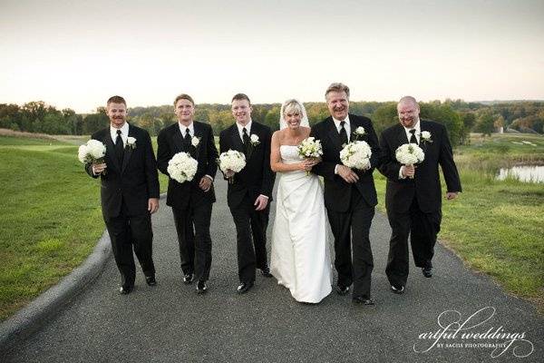 The men look so handsome carrying the bouquets!