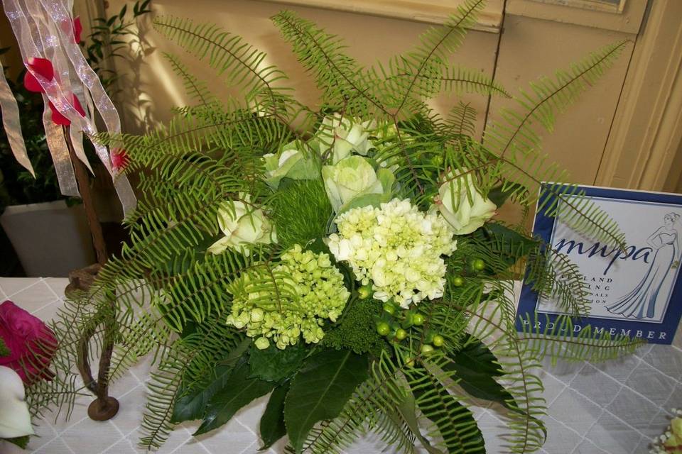 Very 'organic', all-green bouquet.... using naturally green flowers! roses, hydrangea, ornamental kale, hypericum berry, with coral fern accents