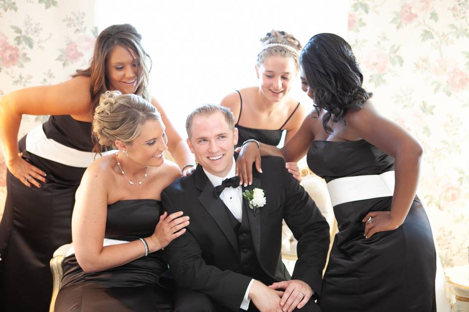 Bridesmaids with groom