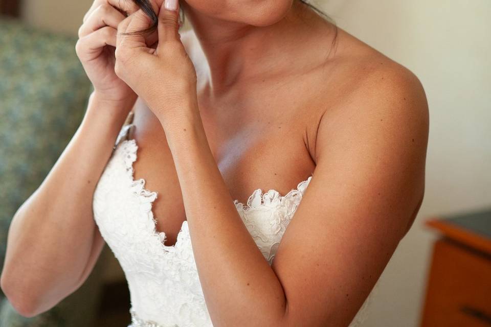 Putting on earrings