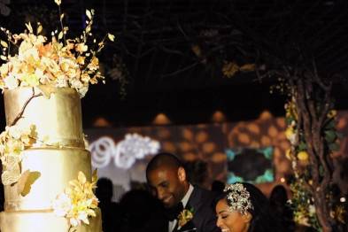 Couple slicing their wedding cake