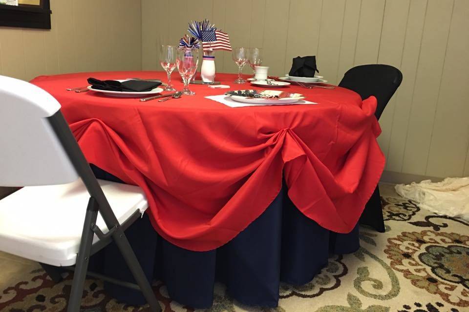 Round table with red and blue table linens