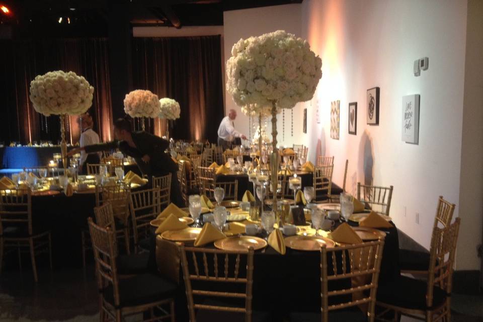 Black tables and gold decor
