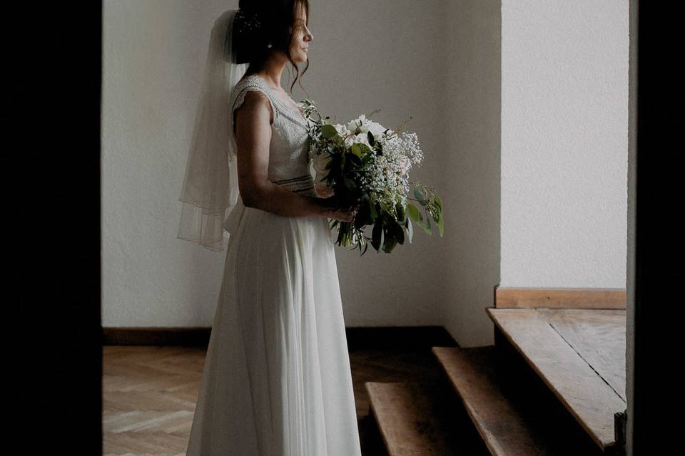The soft and natural light provided by the window was the perfect context for this romantic bride.