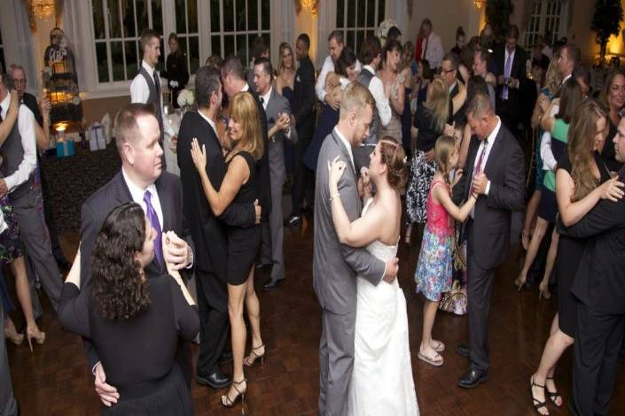 Couple and guests dancing