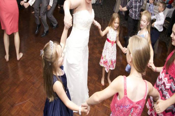 Kids and bride dancing