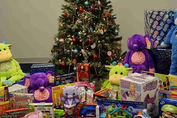 A SANTA TREE SPREAD CHEER IN THE CHILDREN'S PICK A GIFT ROOM!