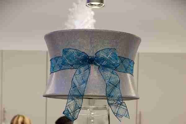 GORGEOUS LAMP LIGHT SHINED BRIGHTLY ON THE RHINESTONE  SNOWFLAKE, THAT GLISTENED IN THE GLASS TAPERED VASE IN THE BAR AREA!