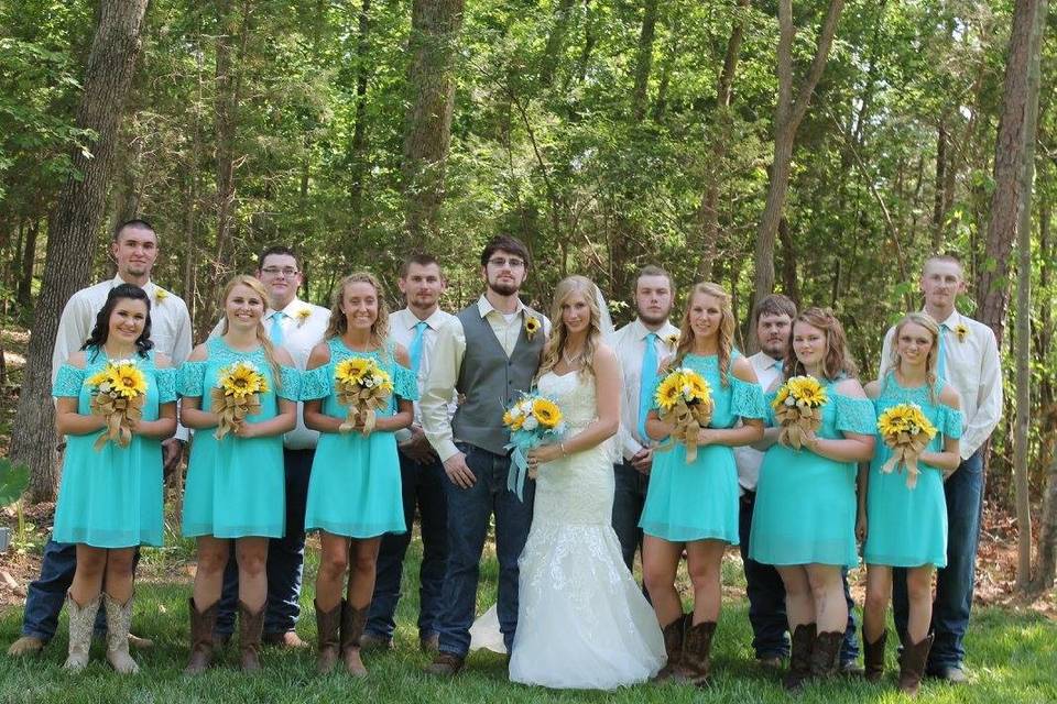 The couple with the bridesmaids and groomsmen