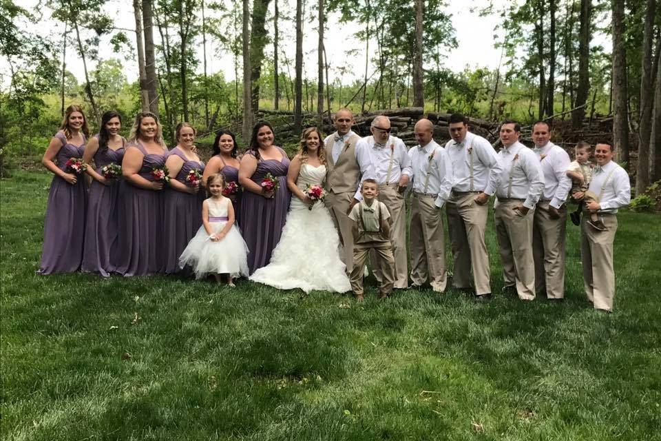 The couple with the bridesmaids and groomsmen