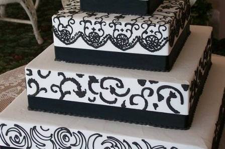 4-tier square wedding cake with black detailing