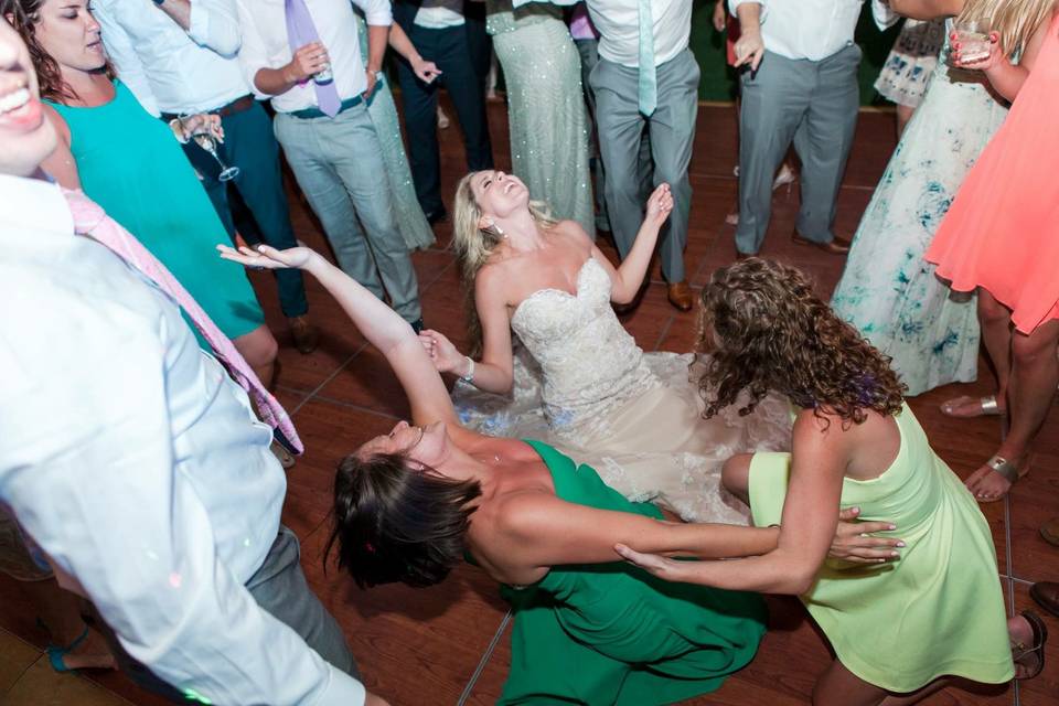 The couple dancing with guests