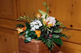 The chocolate cake was adorned with a selection of the day's flowers and snippets of the aqua ribbon.