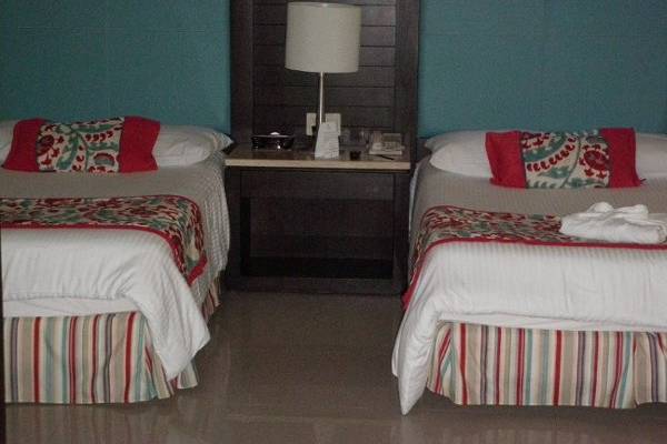 Junior Suite bedroom.  Shown with double beds.  King bed available
