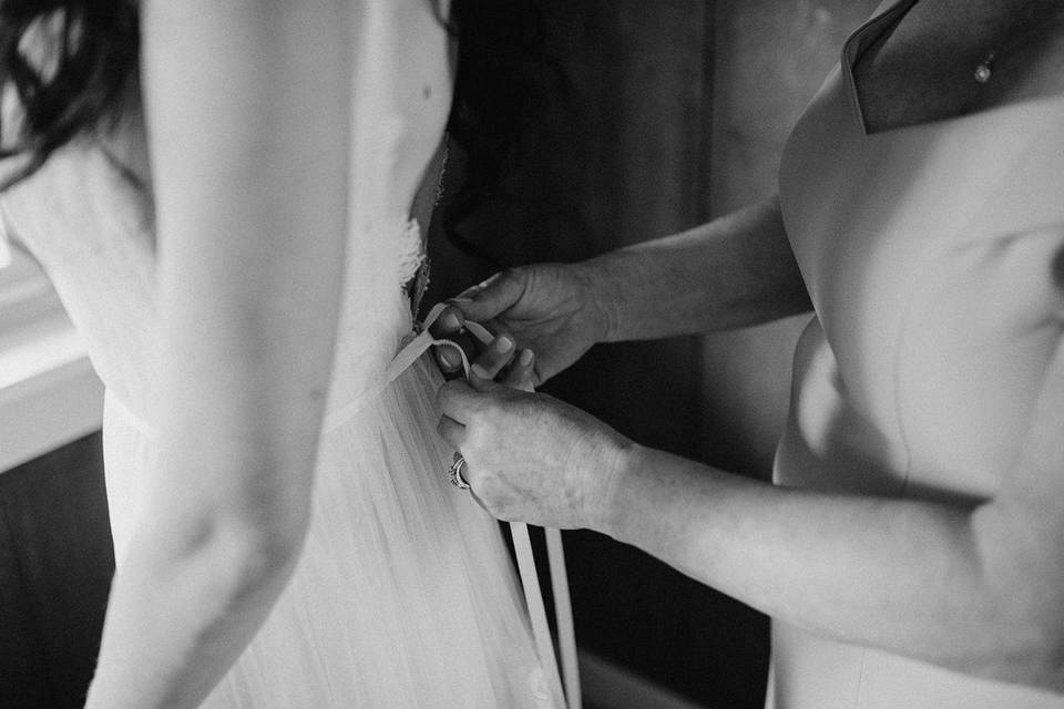 Mother tying up dress