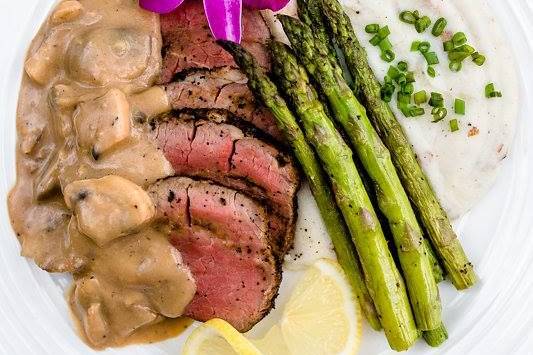 Steak with mushroom sauce and sides