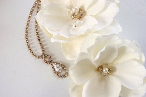 Magnolia Pair with gold filigree and crystal glass center. Gold vintage rhinestone necklace.